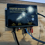 Rooster Booster mounted in hen house